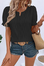 Front view of black Wavelle Blouse showcasing wavy texture and U-neck slit.