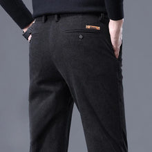 Back view of black Corduroy stretch trousers highlighting back pockets and button detail.