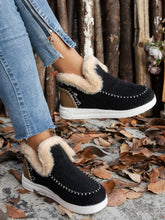Model wearing the Black Furry Suede Round Toe Flat Sneakers, side view