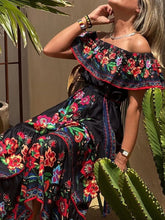 Close-up of black exotic floral print and waist tie on Isadorae Dress.