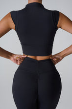 Model back angle view of the Black color Mock Neck Active Tank.