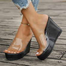 Model wearing black open toe Wedge Sandals paired with a white pearl bracelet
