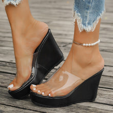 Model wearing black open toe Wedge Sandals paired with a white pearl bracelet