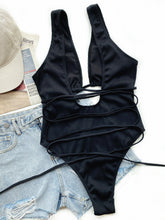 Black ribbed lace-up one-piece swimsuit back flat lay view