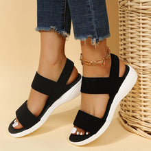 Model wearing Rubber Open Toe Low Heel Sandals, walking side front view