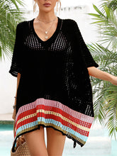 Close-up front view of black slit openwork V-neck half sleeve cover-up highlighting V-neckline and airy openwork knit texture