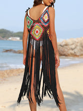 Back view model pose by the beach wearing the Black fringe spaghetti strap cover-up dress
