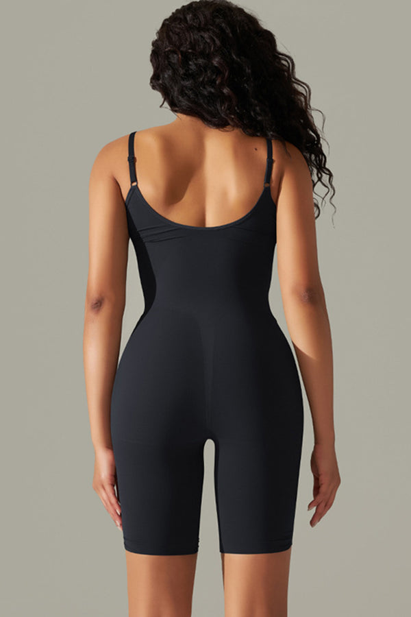 Black active romper back view showing thick spaghetti straps and contoured fit.