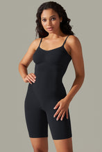 Side profile of black active romper with high-stretch fabric and sculpting fit.