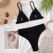 Back flat lay of black spaghetti strap ribbed bikini set showing back clasp closure and adjustable straps