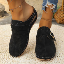 Model front  view of black Suede Round Toe Wedge Sandals highlighting perforation detail