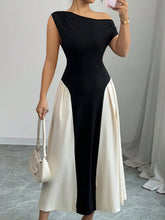 Model front view wearing Black TéMiraj Lumière Contrast Single Shoulder Midi Dress styled with gold hoop earrings and white square open-toe heels.