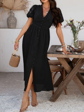 Elegant black Velunira dress styled for a chic evening dinner event.