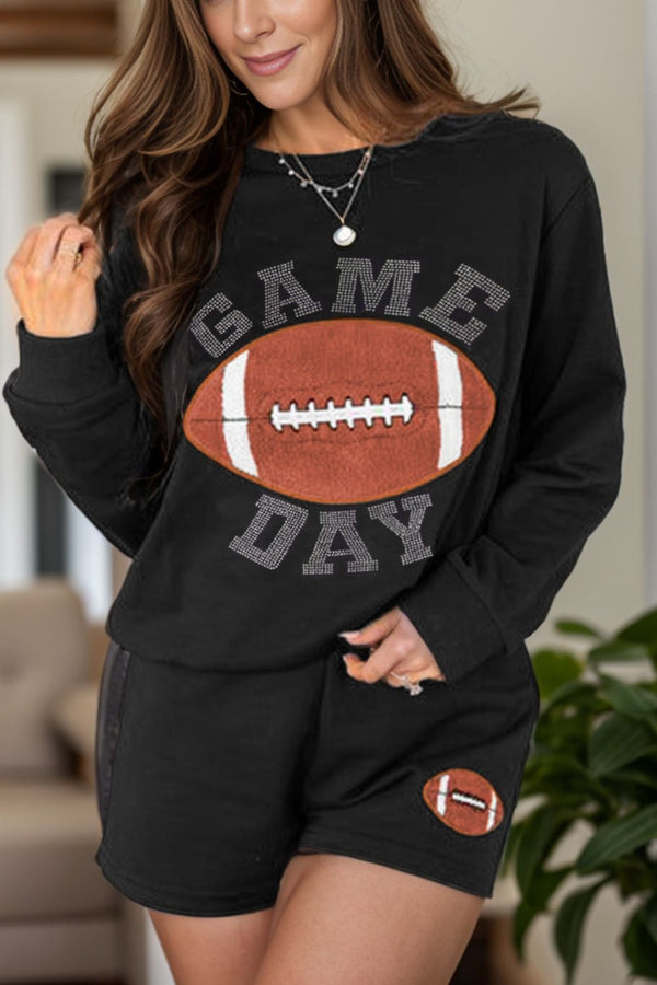 a model wearing the black Blitzelle™ GAME DAY Football Shorts Set paired with jewelry 