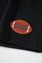 a close-up photo of the football embroidery on the Blitzelle™ GAME DAY Football Shorts