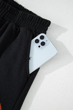 a close-up photo of the Blitzelle™ GAME DAY Football Shorts pocket detailing with a phone inside.