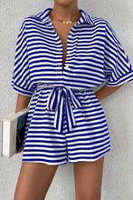 Front view of LineaVerra™ Striped Blue Romper with waist tie and collar.