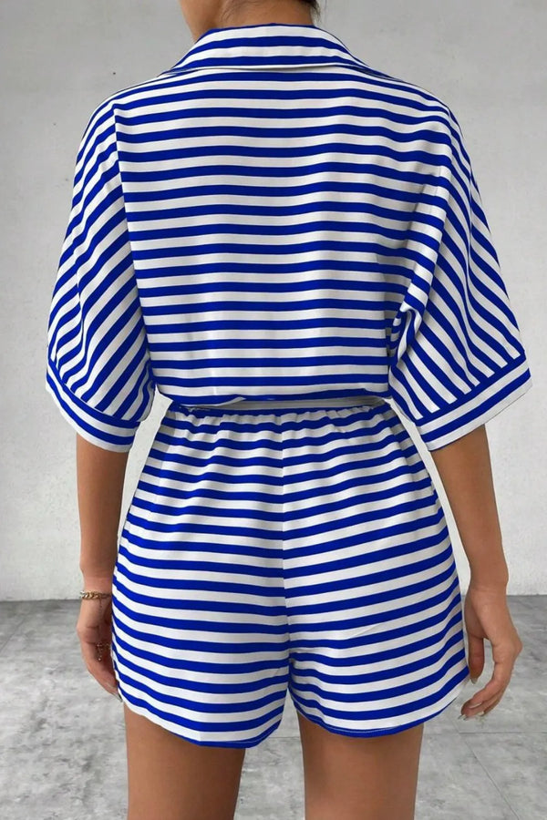Back view of LineaVerra™ Blue Striped Romper with collared neck and cinched waist.