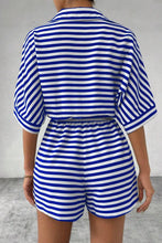 Back view of LineaVerra™ Blue Striped Romper with collared neck and cinched waist.