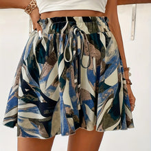 Person wearing Blue AurevaBoho™ Prism Ease Shorts  with a white top 