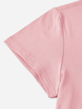 Close-up of CaliVista Tee’s shoulder seams and clean stitching on soft blush pink fabric.