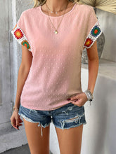 Model styled in blush pink CrochetCharm Top with distressed jean shorts, sneakers, and accessories for a complete look.