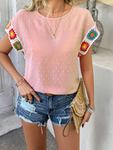 Model styled in blush pink CrochetCharm Top with shorts, sandals, a tan straw purse, and accessories for a complete look.