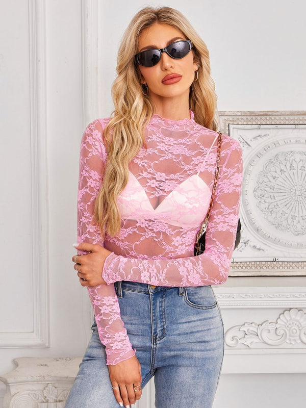 Model wearing a Mock Neck Long Sleeve Lace Sheer Top in blush pink showing intricate floral lace details and flattering fit with denim jeans.