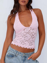 Model wearing blush pink Seraphinelli top with light blue washed jeans, and jewelry for a soft, feminine look.