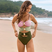 Model wearing blush pink color block sweetheart neck one-piece swimwear front view pose beachside