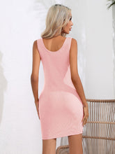 Model back view showcasing the blush pink Curvalicious Allure Bodycon Mini Dress with wide straps and curve-hugging fit.