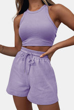 Model showcasing the lavender Boundary Babe Round Neck Top and Drawstring Shorts Set styled for a casual day at a resort.