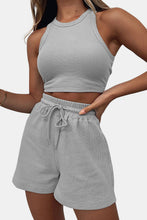 Model wearing light gray Boundary Babe set paired with comfy trainers for airport travel and errands.