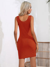 Model back view showcasing the brick red Curvalicious Allure Bodycon Mini Dress with a sleek silhouette and flattering back seam.