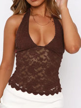 Model wearing brown Seraphinelli top with casual white skirt and jewelry for a soft, feminine look.