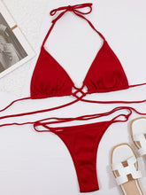 Front flat lay of burgundy halter neck crisscross ribbed bikini set with long adjustable straps and high-cut bottom