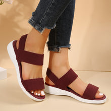 Model wearing Burgundy Rubber Open Toe Low Heel Sandals, side view