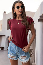 Burgundy ruffled round neck cap sleeve blouse styled close up front view