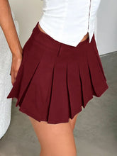 Burgundy Velleté Pleat Skirt side view with white corset showing pleats, belt loop, and bottom hem stitch
