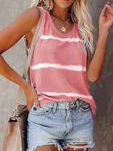 Model wearing a burnt coral tie-dye sleeveless tank with a round neckline, styled with light denim shorts.