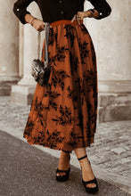 Burnt Umber Elverra Bloomline Maxi Skirt styled with black top and heels