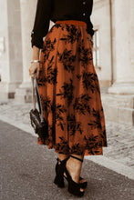 Side view of Burnt Umber Elverra Bloomline Maxi Skirt showcasing botanical embroidery