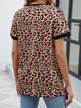 Rear shot of camel leopard print round neck short sleeve tee with an easy, relaxed cut and full leopard pattern coverage.