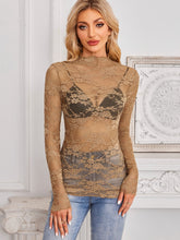 Model wearing a Mock Neck Long Sleeve Lace Sheer Top in camel, showing intricate floral lace details and flattering fit with denim jeans.