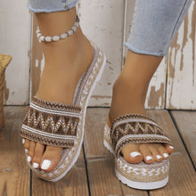 a model wearing a camel pair of Geometric Weave Platform Sandals