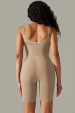 Camel active romper back view showing thick spaghetti straps and contoured fit.