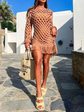 Model in Caramel Fringe Breeze Long Sleeve Cutout Cover-Up walking tropical resort property holding Prada bag, styled with caramel two-piece swimsuit