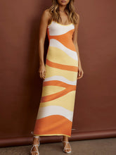 Front view of a model posing in Caramel Luxnometry Maxi Sweater Dress in a sunlit mansion lounge.