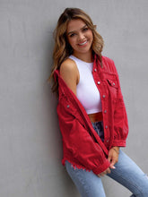 Front view of model wearing a deep red CloudKitten Distressed Drop Shoulder Denim Jacket, styled with button-up front and classic chest pockets.