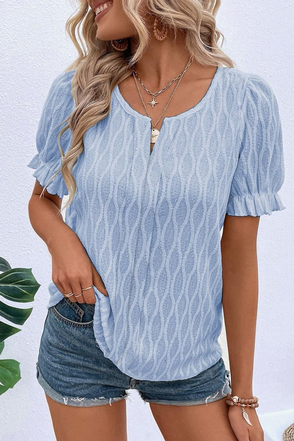 Model wearing Cerulean Wavelle™ Blouse paired with casual pants and accessories.